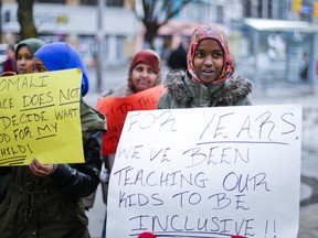 Somali-Canadians demonstrate outside of the Toronto District School Board office on Yonge St, near Sheppard Ave on Tuesday January 14. 
ERNEST DOROSZUK/TORONTO SUN