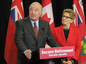 Premier Kathleen Wynne announces on Wednesday, January 22, 2014, that former prime minister Paul Martin will serve as a special adviser to the minister of finance on a made-in-Ontario solution to enhance retirement income security. (Antonella Artuso/Toronto Sun)