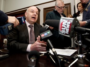 Alberta Health Minister Fred Horne speaks to the media after it was unveiled that a laptop containing the name, date of birth, provincial health card numbers, billing codes, and diagnostic codes of 620,000 Albertans was stolen last September. (DAVID BLOOM/EDMONTON SUN)
