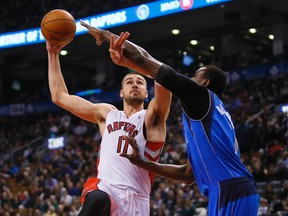 Raptors centre Jonas Valanciunas shoots over a Dallas Mavericks defender during Wednesday night's game. (USA TODAY SPORTS)