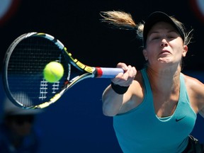 Eugenie Bouchard hits a return to Li Na during their women's semifinal match at the Australian Open in Melbourne on Thursday, Jan. 23, 2014. (Jason Reed/Reuters)