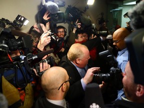 Mayor Rob Ford runs the media gauntlet at City Hall on Wednesday. (DAVE ABEL/Toronto Sun)