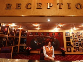 A receptionist waits for guests at Vesna hotel in the Adler district of Sochi January 23, 2014. Sochi hotel managers are getting crash courses in how to smile. (REUTERS/Alexander Demianchuk)