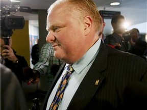 Mayor Rob Ford arrives at his office at City Hall today ignoring reporters questions. (STAN BEHAL/Toronto Sun)