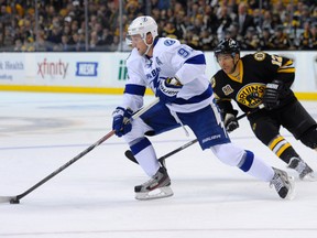 Tampa Bay Lightning center Steven Stamkos (91) skates with the puck while Boston Bruins right wing Jarome Iginla (12) defends during the first period at TD Banknorth Garden. Bob DeChiara-USA TODAY Sports