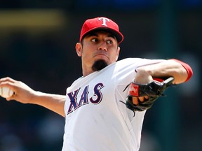 Texas Rangers starter Matt Garza pitches against the Pittsburgh Pirates during MLB interleague play in Arlington, Tex., September 11, 2013. (REUTERS/Mike Stone)