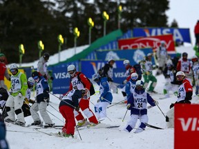 Skiers survey the course during qualifying for the Mens 2014 FIS Freestyle Ski World Cup Mogul Competition at Deer Valley on January 11, 2014 in Park City, Utah.  (Mike Ehrmann/Getty Images/AFP)