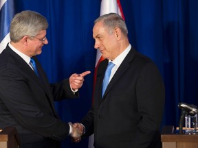 Harper and the Homophobes. Not an edgy punk band from the early 1980s, but, according to the Globe and Mail 's Tu Thanh Ha, the story of Harper's visit to Israel.

REUTERS/Ronen Zvulun