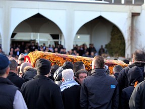 The casket of Ibrahim Chehimi is carried out of the Al-Rashid Mosque in Edmonton, AB., on Thursday, Jan 23, 2014.  Chehimi was shot to death in the parking lot of Hudson Tap House.  Perry Mah/Edmonton Sun