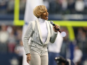 Recording artist Mary J. Blige performs the national anthem prior to the game with the Dallas Cowboys playing against the Oakland Raiders during a NFL football game on Thanksgiving at AT&T Stadium on Nov 28, 2013 in Arlington, TX, USA. (Matthew Emmons/USA TODAY Sports)