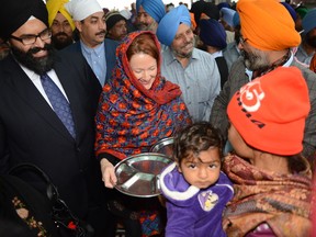 Alberta Premier Alison Redford visits the Golden Temple in India. - QMI Agency