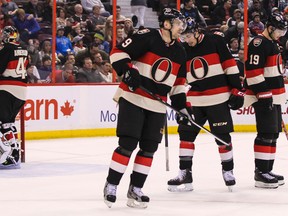 Ottawa Senators' Craig Anderson, Milan Michalek, Cody Ceci, and Jason Spezza following the Florida Panthers scoring during NHL hockey action against the  at the Canadian Tire Centre on Thursday December 19, 2013. Errol McGihon/Ottawa Sun/QMI Agency