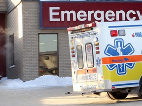 Ambulances sit outside the emergency department at the St. Boniface Hospital in Winnipeg, Man. Wednesday Jan. 8, 2014. (Brian Donogh/Winnipeg Sun)
