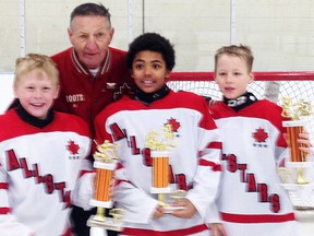 From left: Andrew Munro, Blake Ellis and Donovan McCoy of the Foley Bus Lines atom minor Quinte AAA Red Devils at the Preston International tournament All-Star Game with guest coach Walter Gretzky. (PHOTO SUBMITTED)