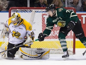 London Knight captain Chris Tierney looks for a rebound from Sarnia Sting goalie Brodie Barrick during OHL action in London, Ont. on Friday January 24, 2014. DEREK RUTTAN/London Free Press/QMI Agency