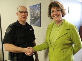 Const. Les Jones wishes Const. Heather Emmons well outside his soon-to-be new office. Emmons is retiring from the Sarnia Police Service after 27 years and Jones is the service's new media relations officer. TYLER KULA/ THE OBSERVER/ QMI AGENCY