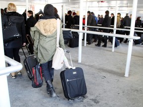 Passengers fill the cabin of the ferry on the way to the Billy Bishop Toronto City Airport Thursday, January 23, 2014. (Veronica Henri/Toronto Sun)