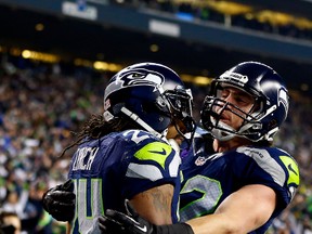 Seattle Seahawks running back Marshawn Lynch (left) celebrates a touchdown against the San Francisco 49ers with tight end Luke Willson during the NFC championship game at CenturyLink Field in Seattle, Jan. 19, 2014. (JONATHAN FERREY/Getty Images/AFP)