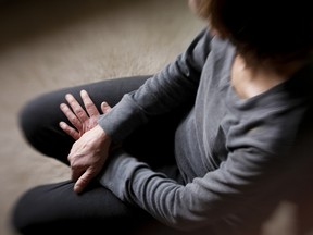 A sexual-assault victim of Keegan Spearchief sits in her home on Thursday January 23, 2014. Spearchief, a violent high-risk sex offender, was released from prison three days ago, and this victim whose incident occurred a decade ago is now fearing for her safety. Lyle Aspinall/Calgary Sun/QMI Agency