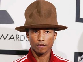 Musician Pharrell Williams arrives at the 56th annual Grammy Awards in Los Angeles, California January 26, 2014.     REUTERS/Danny Moloshok