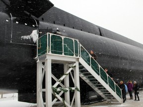 A group of visitors from Bayham climbs aboard HMCS Ojibwa, a Cold War submarine turned into an exhibit for The Museum of Naval History at Port Burwell. The campaign to acquire the sub is the subject of the new documentary Project Ojibwa: Saving a Cold War Warrior.