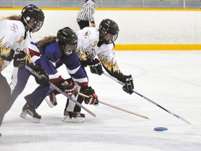 Mariah Looby (3) of the Mitchell U16 ringette team reaches for the ring in her own zone against St. Clements last Thursday, Jan. 23. Looby scored three goals in a 6-2 win. ANDY BADER/MITCHELL ADVOCATE