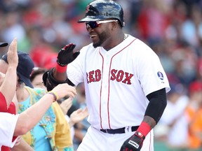Boston Red Sox designated hitter David Ortiz celebrates his solo home in the sixth inning against the Toronto Blue Jays during their MLB American League East baseball game in Boston, Massachusetts, September 22, 2013.  (REUTERS/Dominick Reuter)