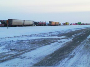 Traffic going eastbound on Highway 1, just before the Portage Diversion, was at a standstill Monday morning as the highway reopened shortly before 7:30 a.m., after being closed since 11:30 a.m. Sunday, due to poor visibility and blowing snow. (Lisa Sylvester/THE GRAPHIC/QMI AGENCY)