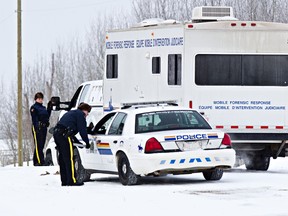 Police on scene after one officer was shot and another was run over at Township Road 524 and Range Road 192 near Tofield, Alta., on Tuesday, Jan. 7, 2014. Codie McLachlan/Edmonton Sun/QMI Agency