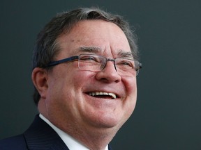 Canada's Finance Minister Jim Flaherty reacts during a news conference in Ottawa January 27, 2014. (CHRIS WATTIE/REUTERS)