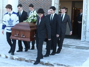 Pallbearers carrying Peter McSheffrey's casket out of the Kelly Funeral Home chapel on Woodroffe Ave. Monday, Jan. 27, 2014. The Ottawa family man was killed in a terrorist attack in Afghanistan Jan. 17. 
(DOUG HEMPSTEAD/Ottawa Sun/QMI Agency)