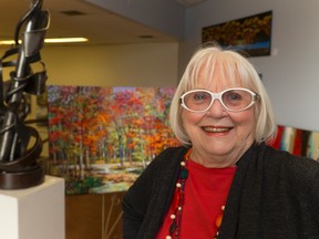 Art With Panache owner Audrey Cooper shows some of the fine art for sale at her downtown location in the Talbot Centre in London. She markets her own and others? works. (MIKE HENSEN, The London Free Press)