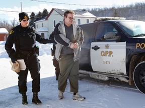 James Beau Jeffery, charged with second-degree murder in the death of his mother in August/September 2011, is escorted inside Picton Courthouse by OPP officers on the first day of his trial Monday, Jan. 27, 2014.  - JEROME LESSARD/The Intelligencer/QMI Agency