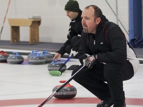 Noel Herron, skip for the Chris Barkley team, keeps an eye on the rocks during  the Whig-Standard Bonspiel at the Royal Kingston Curling club on Saturday. (Julia McKay/The Whig-Standard)