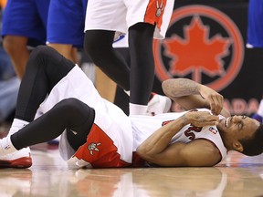Raptors' DeMar DeRozan grimaces as he goes down in pain against the Los Angeles Clippers at the Air Canada Centre on Saturday. It remains unclear when the guard will return to the lineup. (USA TODAY SPORTS/PHOTO)