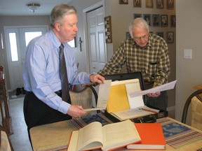 In this file photo taken in 2009, Bob Harrison, right, shows Garry McDonald  historic material and other records from the former St. Clair Parks Commission. Harrison, general manager of the commission from 1973 until he retired in 1991, died Monday at age 84. McDonald worked with Harrison at the commission. FILE PHOTO/THE OBSERVER/QMI AGENCY