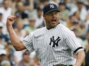 Roger Clemens pumps his fist during a start as a New York Yankee. (REUTERS)