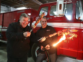 Celebrity Chef Ted Reader, left, with George Tchor of Kreater in front of a 1973 vintage Ford fire truck which is being transformed into a one-of-a-kind BBQ rig.
