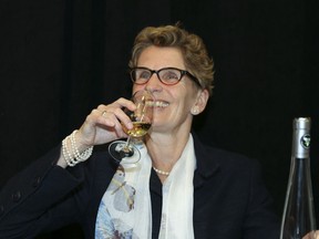 Premier Kathleen Wynne samples ice wine at the Queen's Quay LCBO in Toronto on January 15.
VERONICA HENRI/TORONTO SUN