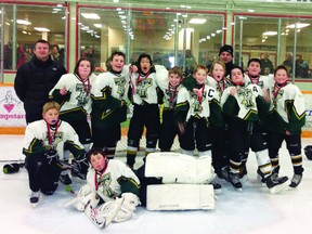 The Portage Terriers peewee 5 team celebrates their gold medal, won at a Winkler tournament. (L-R): Sam Younka, Emma Mooney, Carter Parynuik, Nigel Nelson, Jayden Peterson, Cole Butler, Andy Young, Clark Bolton, Spencer Lilley, Noah Green; Front: goalie Skyler (from Thompson); Coaches: James Bolton, jason Green; Missing: Jaden Pashe, Grayson Pashe, Skylar Williams (submitted photo)