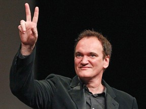 U.S. director Quentin Tarantino gestures after receiving the Prix Lumiere award during a ceremony at the 5th Festival Lumiere in Lyon, in this October 18, 2013, file photo. (REUTERS/Robert Pratta/Files)