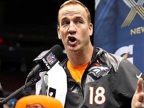 Broncos QB Peyton Manning answers questions during Super Bowl Media Day in Newark, N.J., on Tuesday, Jan. 28, 2014. (Shannon Stapleton/Reuters)