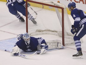 Leafs goalie Jonathan Bernier makes a sprawling save on Tampa Bay's Martin St. Louis during Tuesday night's game. (JACK BOLAND/QMI Agency)