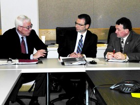 Star photo
Fergus P. Kerr (left), George Gritziotis and John Perquin chat during a break Tuesday in the first meeting of the advisory panel for the mining review.