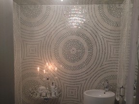 Floor-to-ceiling mosaic tiles are the ‘wow’ factor in this powder room.