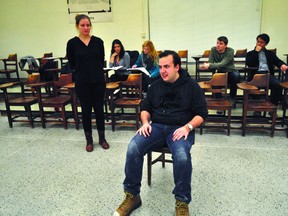 Actors Jessika McQueen and Jonathan English (front) rehearse a scene from Colleen Wagner’s The Monument Jan. 15, 2014 in London Ont. while director Ashley Patenaude (left) and stage manager Heather Smart look on with Trivial Theatre co-founders Kevin Liang (right) and Nicholas Harrison. CHRIS MONTANINI\LONDONER\QMI AGENCY