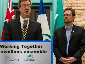 Ottawa Mayor Jim Watson and Gatineau Mayor Maxime Pedneaud-Jobin established clear priorities that will see their two cities work together on common issues. January 29, 2014. (Errol McGihon/Postmedia)