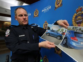 Acting Sgt. Neil Thompson address the media on a recent attack on a mother and child and got away by carjacking another person during a news conference at police downtown headquarter in Edmonton, AB., on Wednesday, Jan 29, 2014. Perry Mah/  Edmonton Sun