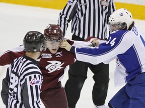 Peterborough Petes' Cameron Lizotte exchanges pleasantries with Sudbury Wolves' David Zeppieri during OHL action Jan. 23 at the Memorial Centre. The Petes face the Ottawa 67's tonight. Clifford Skarstedt/Examiner file photo