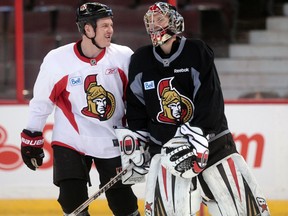 Senators Chris Neil and Craig Anderson chat during practice at Canadian Tire Centre on Wednesday. Tony Caldwell/Ottawa Sun